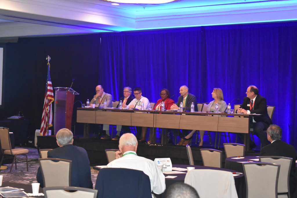 A group of panelists give a presentation