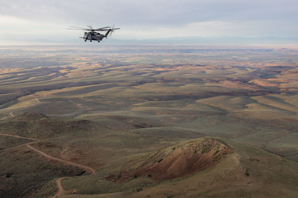 U.S. Marines with Marine Heavy Helicopter Squadron (HMH) 361, Marine Aircraft Group (MAG) 16, 3rd Marine Aircraft Wing (MAW) practice maneuvering through different terrain during a flight at Mountain Home Air Force Base, Idaho, June 8, 2023. The squadron practiced maneuverability to keep the air crew flexible while doing their job. (U.S. Marine Corps photo by Cpl. Nayomi Koepke)